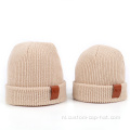 Volwassen kindre lederen label gebreide beanie hoed
